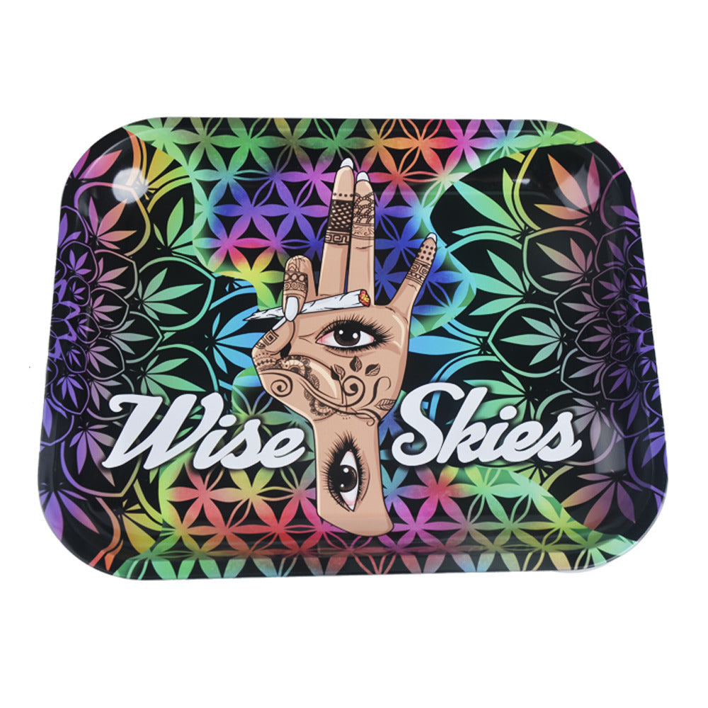 Colorful tray with hand design and 'Wise Skies' text on a multicolored floral background