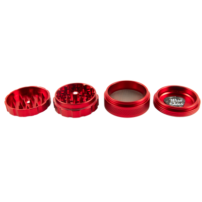 Set of red metal grinders on a white background