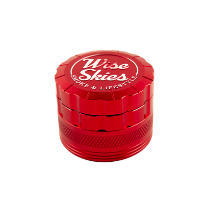 Red grinder with 'Wise Skies' branding on a white background